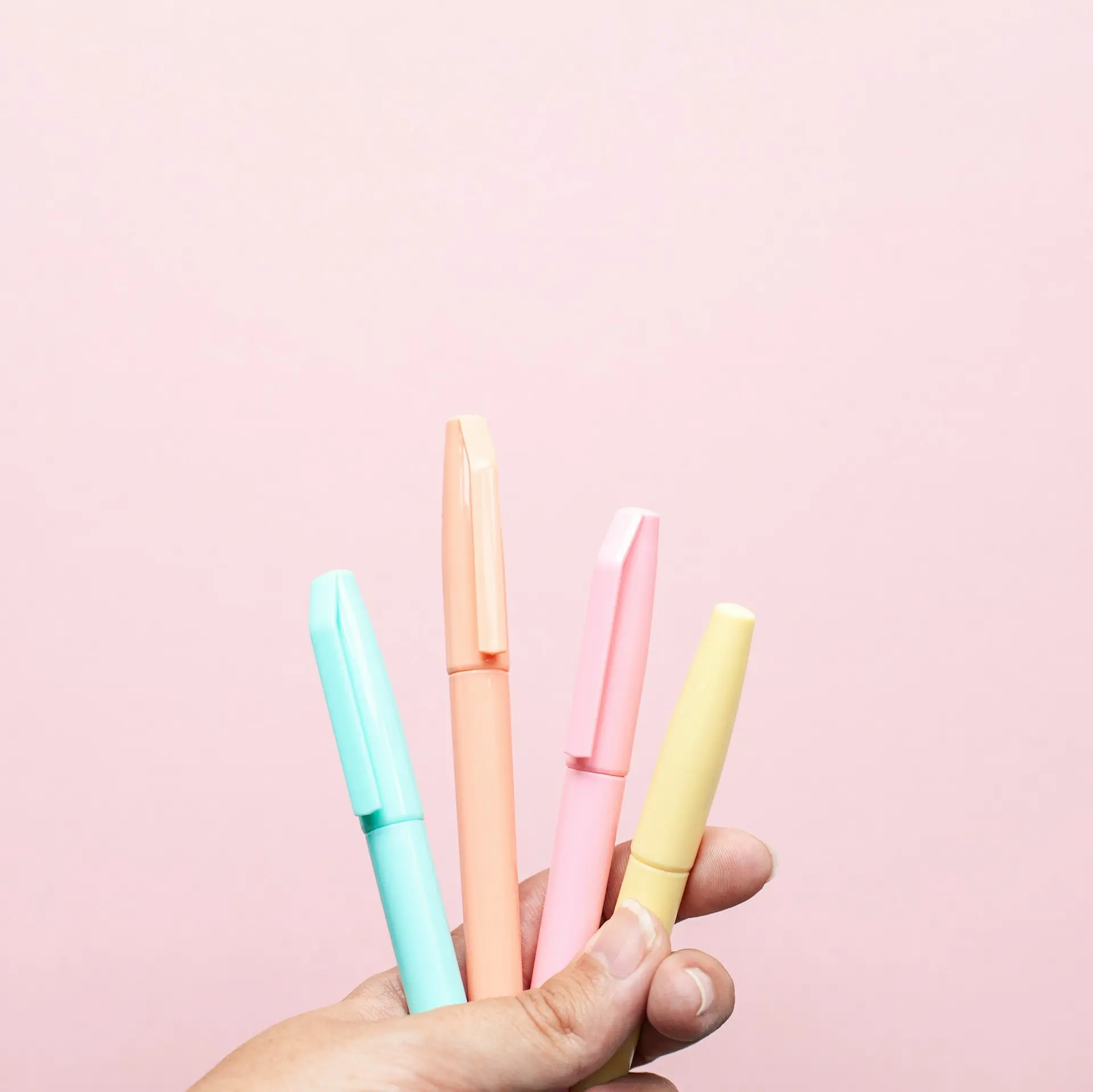 four assorted-color pens